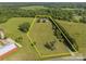 Expansive property aerial showcasing the well-maintained land, mature trees, and home at 130 Johnson Dairy Rd, Rockwell, NC 28138