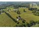 Breathtaking aerial view of land, a house, surrounded by nature for ultimate serenity at 130 Johnson Dairy Rd, Rockwell, NC 28138