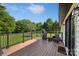 Relax on this inviting back deck with black metal railings, perfect for enjoying the serene backyard views at 130 Johnson Dairy Rd, Rockwell, NC 28138