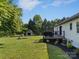 Expansive backyard with a trampoline, playset, and storage shed, perfect for outdoor activities and Gathering fun at 130 Johnson Dairy Rd, Rockwell, NC 28138
