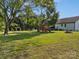 Lush backyard featuring mature trees, a playset, trampoline, and shed for endless outdoor enjoyment at 130 Johnson Dairy Rd, Rockwell, NC 28138