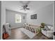 Bedroom with neutral walls, ceiling fan, wood-look floors, and low-profile crib at 130 Johnson Dairy Rd, Rockwell, NC 28138