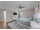 Cozy bedroom featuring a ceiling fan, a white dresser with a TV, and a neutral rug at 130 Johnson Dairy Rd, Rockwell, NC 28138