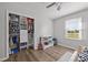 Bedroom with wood-look flooring and open closet with organized storage solutions at 130 Johnson Dairy Rd, Rockwell, NC 28138