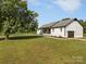 Charming home with a well-manicured lawn, featuring a covered front porch and a garage at 130 Johnson Dairy Rd, Rockwell, NC 28138