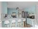 A spacious kitchen featuring light blue cabinets and stainless steel appliances at 130 Johnson Dairy Rd, Rockwell, NC 28138