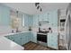 Cozy kitchen with light blue cabinets, stainless steel appliances, and ample counter space at 130 Johnson Dairy Rd, Rockwell, NC 28138