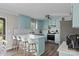 Kitchen featuring light blue cabinets, stainless steel appliances, and an island with bar seating at 130 Johnson Dairy Rd, Rockwell, NC 28138