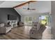 Inviting living room showcasing hardwood floors, a comfortable sofa, and a TV on the accent wall at 130 Johnson Dairy Rd, Rockwell, NC 28138
