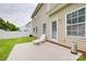 This backyard has a concrete patio, vinyl siding, green grass, white fence, and a white lounge chair at 1532 Andora Dr, Rock Hill, SC 29732