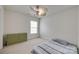 This simple bedroom features a green dresser, a window, neutral carpet and a bed at 1532 Andora Dr, Rock Hill, SC 29732