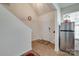Bright foyer with tile flooring, staircase, neutral walls, and a view of the front door and stainless refrigerator at 1532 Andora Dr, Rock Hill, SC 29732