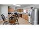 Kitchen with wooden cabinets, tile flooring, black appliances, and a stainless steel refrigerator at 1532 Andora Dr, Rock Hill, SC 29732