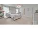 A bright main bedroom features a ceiling fan, two windows, and a white wood bed frame with matching nightstand at 1532 Andora Dr, Rock Hill, SC 29732