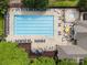 Aerial view of the community pool that features seating and shady gazebos for relaxation at 15913 Trenton Place Rd, Huntersville, NC 28078