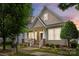 Charming home featuring shingle siding, manicured landscaping, and inviting front porch at 15913 Trenton Place Rd, Huntersville, NC 28078