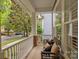Welcoming front porch with bench seating, perfect for relaxing outdoors at 15913 Trenton Place Rd, Huntersville, NC 28078
