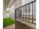 Exterior view of the home with stone walkway, and black railing at 15913 Trenton Place Rd, Huntersville, NC 28078