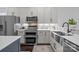 Contemporary kitchen with stainless steel appliances, double oven, and stylish backsplash at 15913 Trenton Place Rd, Huntersville, NC 28078