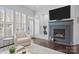 Bright living room with fireplace, large windows, and comfortable seating at 15913 Trenton Place Rd, Huntersville, NC 28078