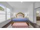 Serene main bedroom with a large window, soft lighting, and elegant decor at 15913 Trenton Place Rd, Huntersville, NC 28078