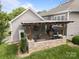 Beautiful outdoor patio features a TV, grilling area, and seating space for outdoor enjoyment at 15913 Trenton Place Rd, Huntersville, NC 28078