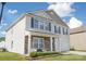 Charming two-story home featuring stone accents, inviting porch, and well-maintained landscaping at 1600 Gaston Mountain Dr, Dallas, NC 28034