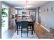 Stylish kitchen and dining area with stainless steel appliances and modern lighting at 1600 Gaston Mountain Dr, Dallas, NC 28034