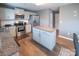 A kitchen with stainless steel appliances, center island, and light grey cabinets at 1600 Gaston Mountain Dr, Dallas, NC 28034