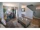 Inviting living area with dining space, modern decor, and staircase access at 1600 Gaston Mountain Dr, Dallas, NC 28034