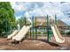 Community playground with slides and climbing structures with a pool in the background at 1600 Gaston Mountain Dr, Dallas, NC 28034