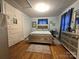 Charming bedroom with hardwood floors and ample storage space with mirrored furniture at 1922 Salem Church Rd, Lincolnton, NC 28092