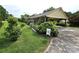 Exterior view featuring a covered carport and lush landscaping at 1922 Salem Church Rd, Lincolnton, NC 28092