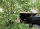 Exterior shot showing a garage partially obscured by trees at 1922 Salem Church Rd, Lincolnton, NC 28092