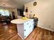 Kitchen featuring an island counter, cooktop, and wood floors at 1922 Salem Church Rd, Lincolnton, NC 28092