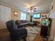 Inviting living room with a plush sectional sofa and a ceiling fan for added comfort at 1922 Salem Church Rd, Lincolnton, NC 28092