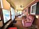 Sun room with comfortable seating and sliding doors at 1922 Salem Church Rd, Lincolnton, NC 28092