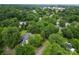Aerial view of a house surrounded by lush greenery, showcasing its location within a tree-filled neighborhood at 206 Rose Ter, Wadesboro, NC 28170