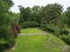 Sprawling backyard with a white picket fence and plenty of space for outdoor activities at 206 Rose Ter, Wadesboro, NC 28170