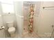 Cozy bathroom with floral shower curtain and classic fixtures at 206 Rose Ter, Wadesboro, NC 28170