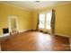 Bright bedroom with light yellow walls, wood floors, and large windows at 206 Rose Ter, Wadesboro, NC 28170