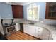 Updated kitchen with stainless steel appliances, white cabinets, and tiled backsplash at 206 Rose Ter, Wadesboro, NC 28170