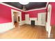 Bright living room with built-in cabinets, a chandelier, a fireplace and hardwood floors at 206 Rose Ter, Wadesboro, NC 28170