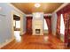 Spacious living room features a fireplace and hardwood floors, creating a warm and inviting space at 206 Rose Ter, Wadesboro, NC 28170