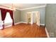 Spacious living room featuring hardwood floors, high ceilings, and classic decorative trim at 206 Rose Ter, Wadesboro, NC 28170
