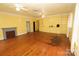 Spacious living room with hardwood floors, built-in shelving, and a cozy fireplace at 206 Rose Ter, Wadesboro, NC 28170