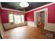 Charming living room with large windows, hardwood floors, and a decorative fireplace at 206 Rose Ter, Wadesboro, NC 28170