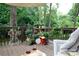 Relaxing outdoor deck with seating, adorned with lush plants creating a peaceful retreat at 211 Southfork Dr, Belmont, NC 28012
