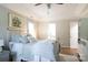 Bedroom features a white metal bed frame, modern furnishings, and tray ceiling at 211 Southfork Dr, Belmont, NC 28012