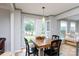 Charming dining area featuring a wooden table and abundant natural light from the window at 211 Southfork Dr, Belmont, NC 28012